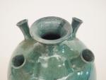 PRIMAVERA.
Vase boule à cinq cols en céramique turquoise flammée. Signé
H....