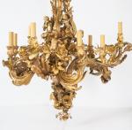 CAFFIERI (d'après).
Exceptionnel lustre en bronze de style Louis XV d'après...