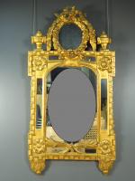 Grande glace Louis XVI en bois doré, à décor de...