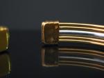Bracelet jonc deux tons d'or à quatre rangs.
Poids. 13,63 g