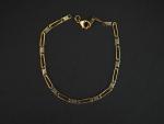 Bracelet articulé deux tons d'or.
Long. 19 cm
Poids. 6,69 g 
(fermoir...