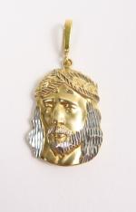Pendentif en or 14 carats représentant la tête du Christ....