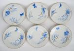 12 assiettes Napoléon III  en porcelaine, à décor en...