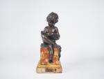 CANOVA. 
" Enfant Lisant "
Sculpture en bronze à patine brune....