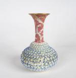 Vase XIXème en porcelaine polychrome à décor en relief de...