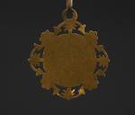 Médaille religieuse de forme polylobée en or jaune, à décor...