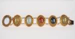 Chine, vers 1920, 
Bracelet en cuivre doré orné de six...