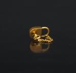 Cadenas et sa clé en or jaune. 
H. 1,3 cm
Poids....