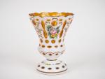 Vase cornet 1900 en overlay à décor de fleurs polycromes...