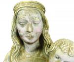 Vierge à l'Enfant en pierre sculptée et polychromée. Debout, elle...