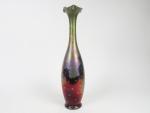 Clément MASSIER. 
Vase en céramique, à décor irisé de fleurs....