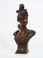 VAN DER STR&ETEN. 'Jeune fille au chignon'. Sculpture en bronze...