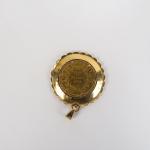 Pièce de 20 Francs or 1855-A, montée en pendentif. 
Monture...