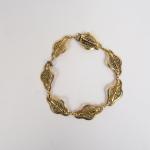 Bracelet en or jaune, à décor de filigranes.
Poids. 15,90 g