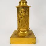 Paire de candélabres XIXème en bronze patiné et doré, reposant...