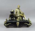 Pendule XIXème en marbre noir et bronze, à décor d'un...