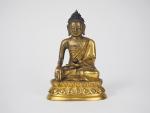 Statuette en bronze doré, représentant Bouddha assis sur un lotus...