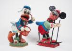 Paire de sujets en bois sculpté polychrome "Mickey" et "Donald".
H....