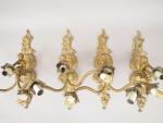 Suite de quatre appliques en bronze de style Louis XV,...