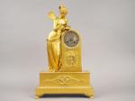 Pendule XIXème en bronze doré, à décor d'une femme ailée...