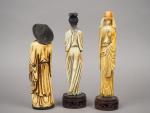 Ensemble comprenant trois statuettes en ivoires polychrome représentant un maraicher,...