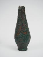 Vase fusiforme en alliage cuivreux. Proche-Orient. Ier millénaire av. J.-C....