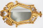 Miroir XVIIIème de style italien en bois sculpté, doré et...