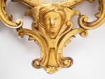 Miroir XVIIIème de style italien en bois sculpté, doré et...